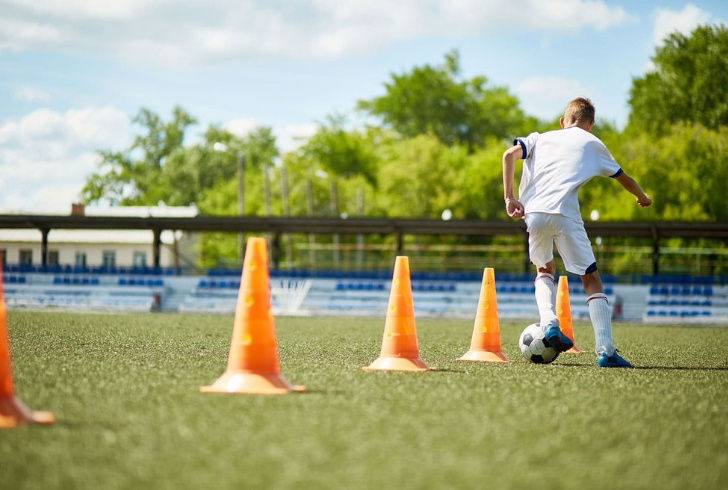 Test your ball control by weaving through a cone obstacle course.